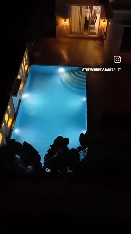 The pool lit at night